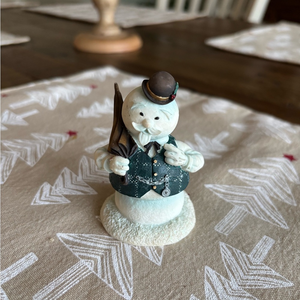 Charming Snowman Figurine with Black Hat and Green Vest